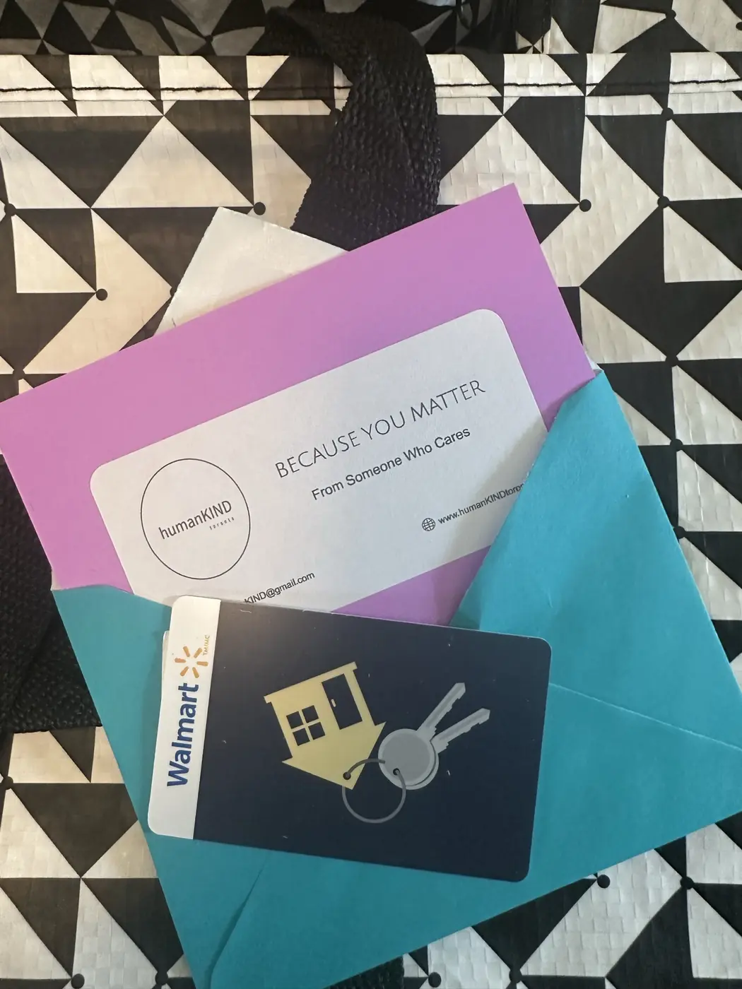 A Gift of Hope card reading Because you matter, tucked into a colourful envelope