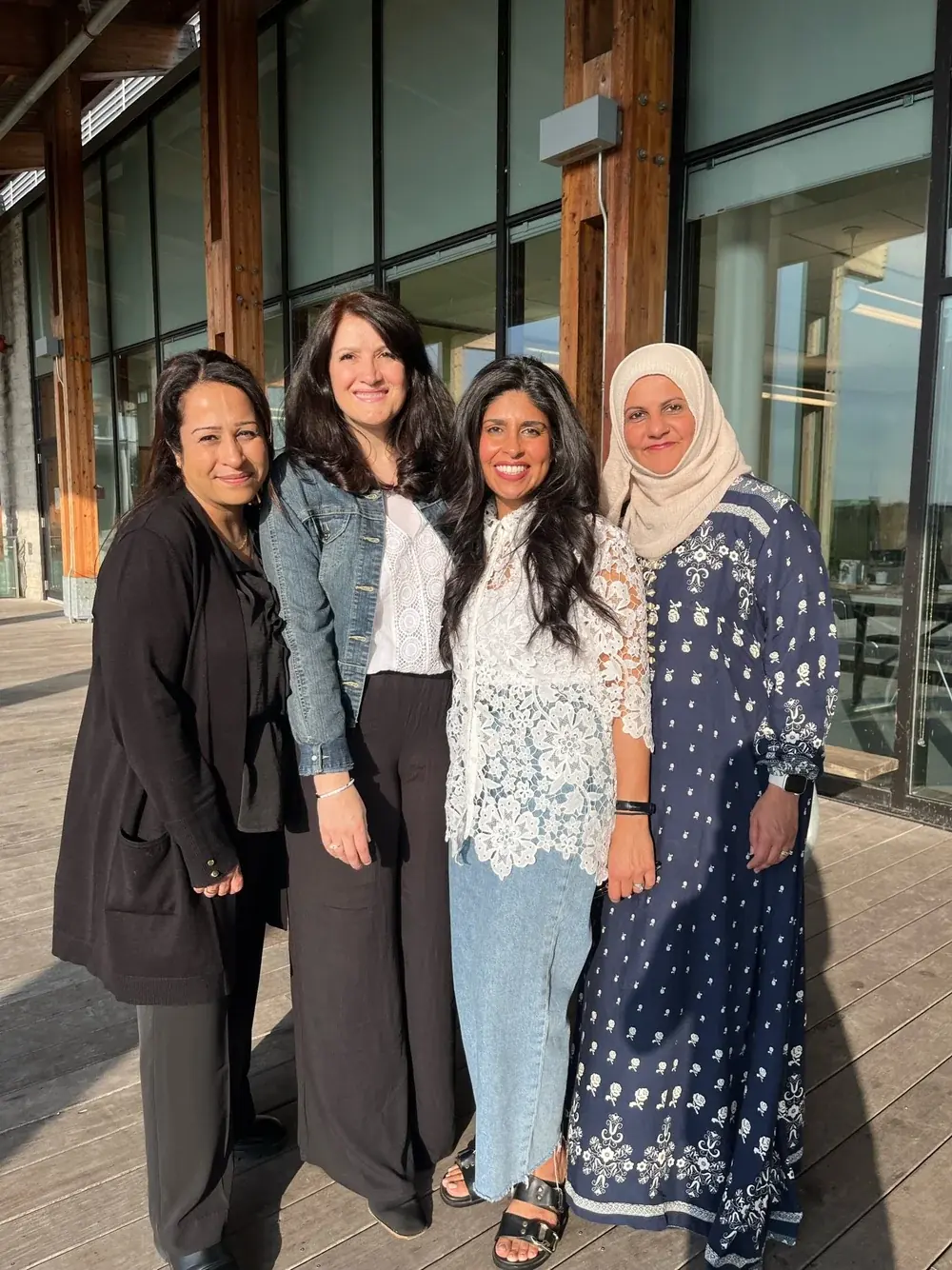 The four members of the humanKIND toronto core team standing together outdoors