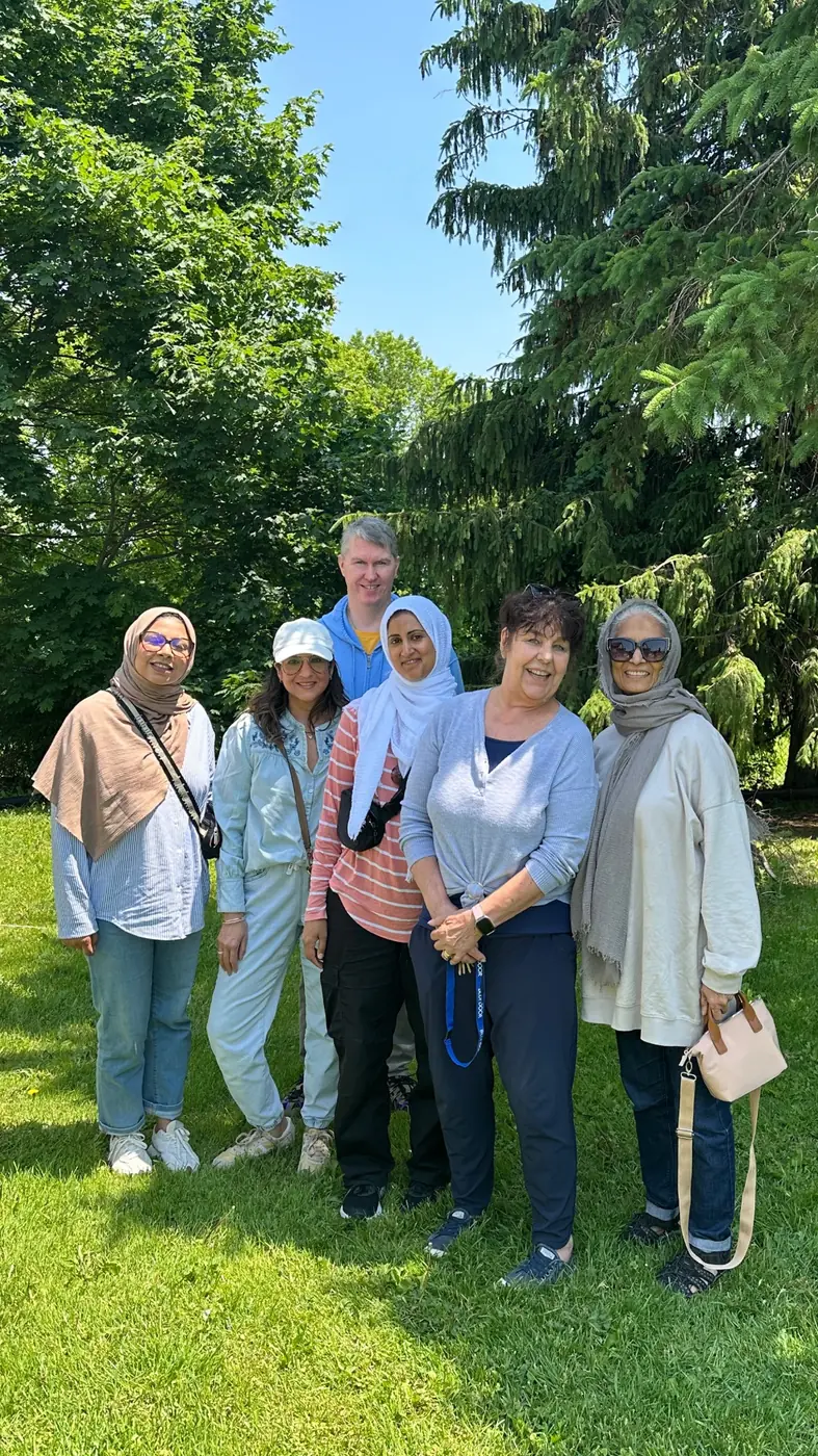 Volunteers gathered outdoors in a park